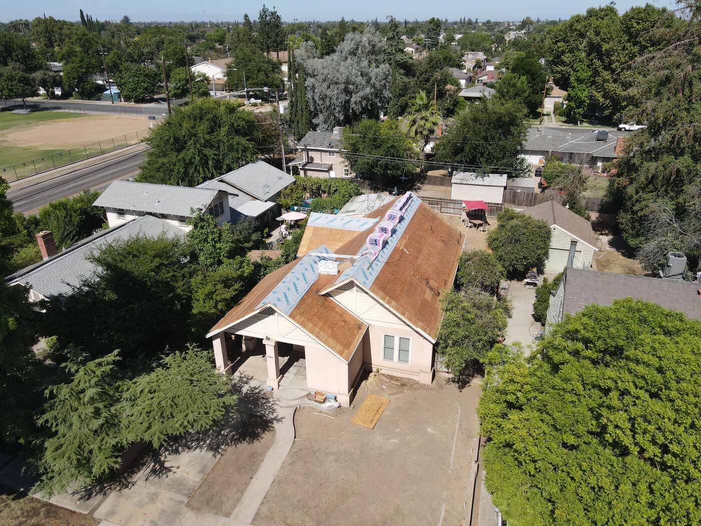 New synthetic underlayment and materials staged on a Fresno reroof