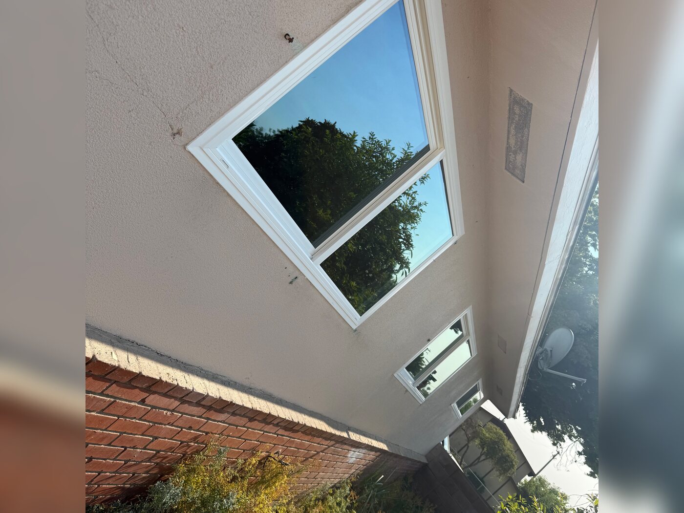 Finished white vinyl window on a Fresno, CA home