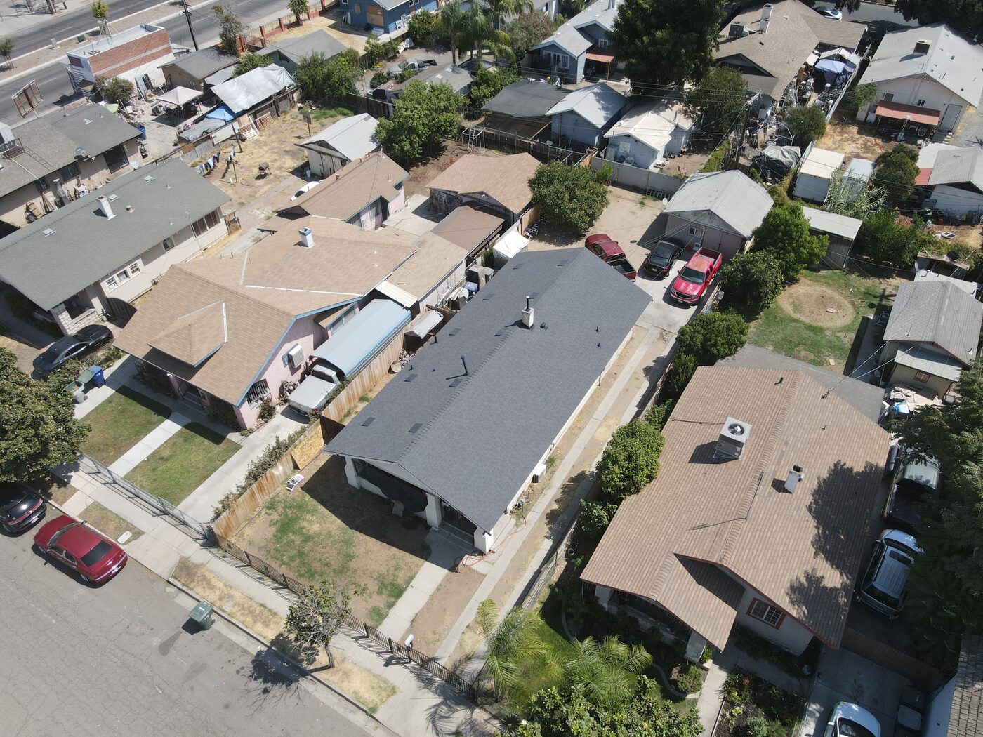 Aerial view of a finished charcoal architectural shingle roof on a Fresno, CA bungalow