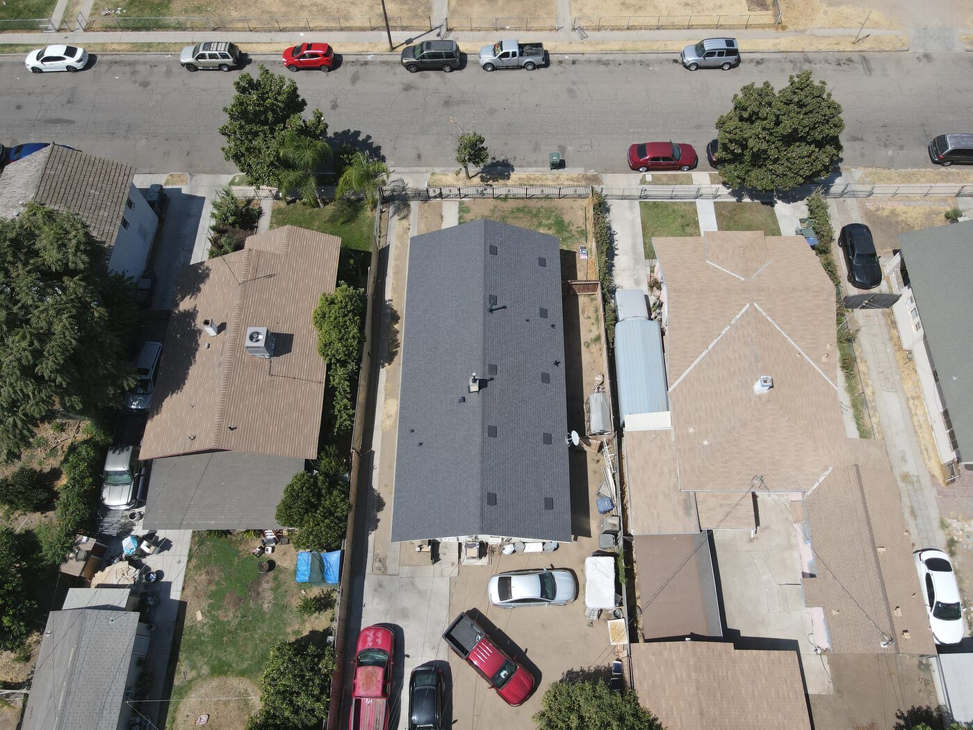 Top-down view of the completed charcoal shingle roof on the Fresno bungalow