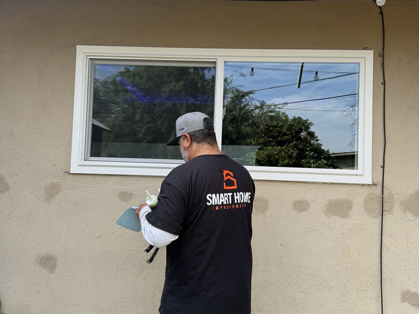 Smart Home Improvements crew working on a home exterior in Fresno, CA