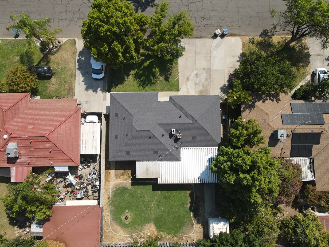 Completed shingle roof with clean ridge lines on a Fresno, CA home