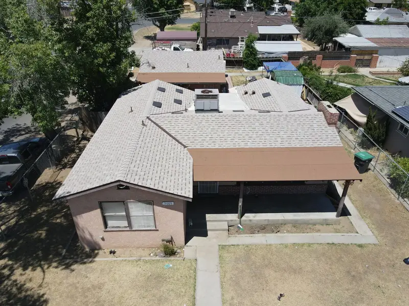 Aerial view of a finished charcoal architectural shingle roof in Fresno, CA