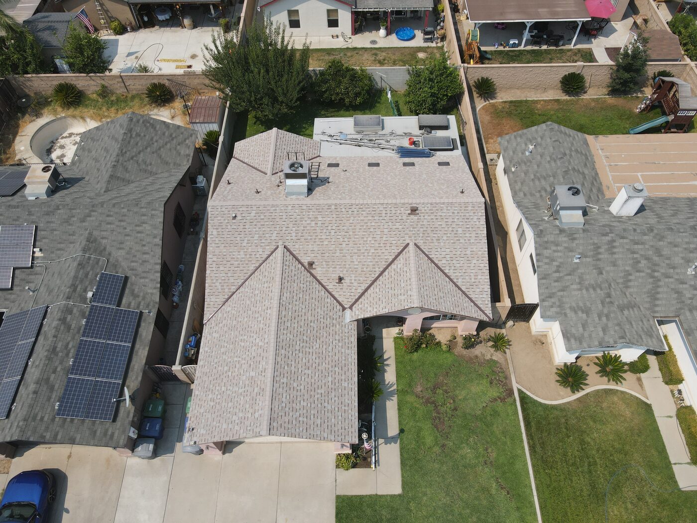 New residential shingle roof in Parlier, CA, aerial view