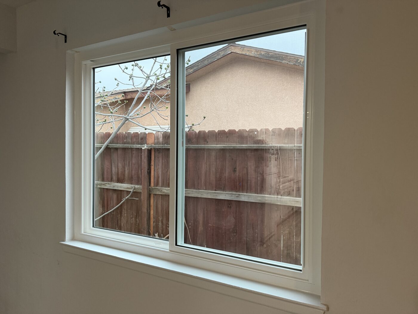 New white vinyl window on a stucco home in Fresno, CA