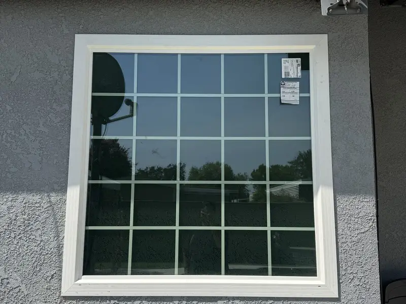 New white vinyl grid window installed on a Visalia, CA home