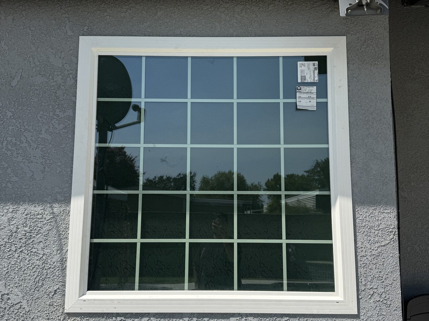 New white vinyl grid window installed on a Visalia, CA home