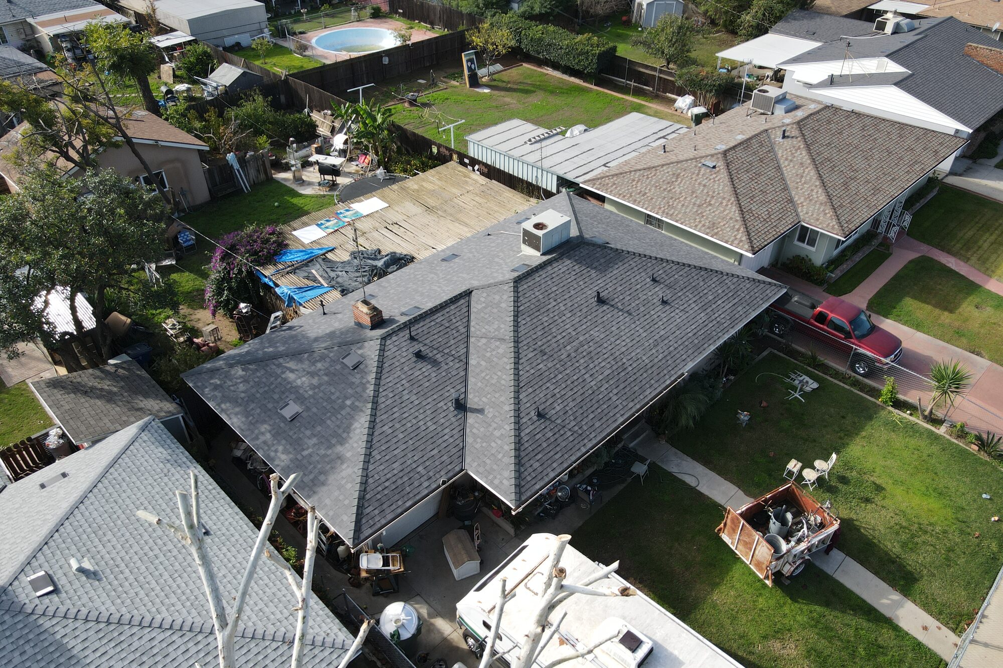 Aerial view of a completed architectural shingle roof installed by Smart Home Improvements in Fresno, CA