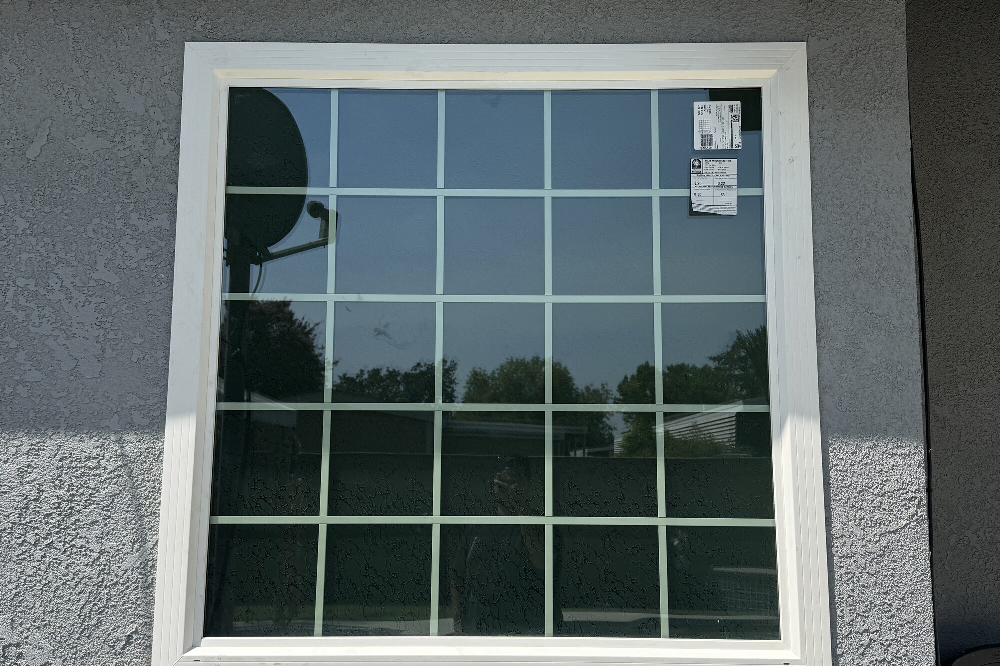 New white vinyl grid replacement window on a Visalia, CA home